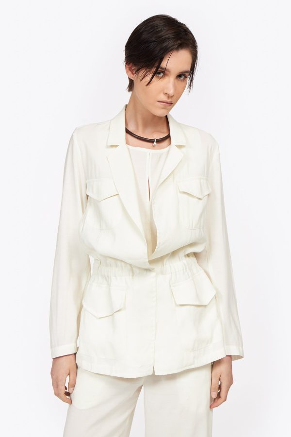 Timeless qualitative drawstring jacket crafted from rayon. This relaxed style featured two decorative chest pockets and another two at the front is a must have for the summer, and concealed pleat at the back. An investment piece for all summers to come.