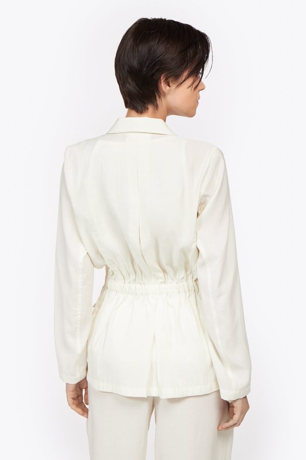 Timeless qualitative drawstring jacket crafted from rayon. This relaxed style featured two decorative chest pockets and another two at the front is a must have for the summer, and concealed pleat at the back. An investment piece for all summers to come.